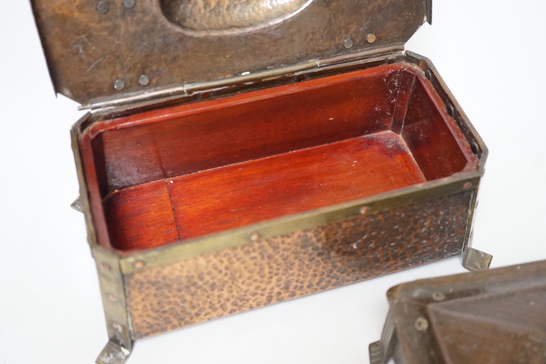 An Arts & Crafts hammered copper and brass mounted casket 23cms wide x 9cms high, together with a smaller similar casket